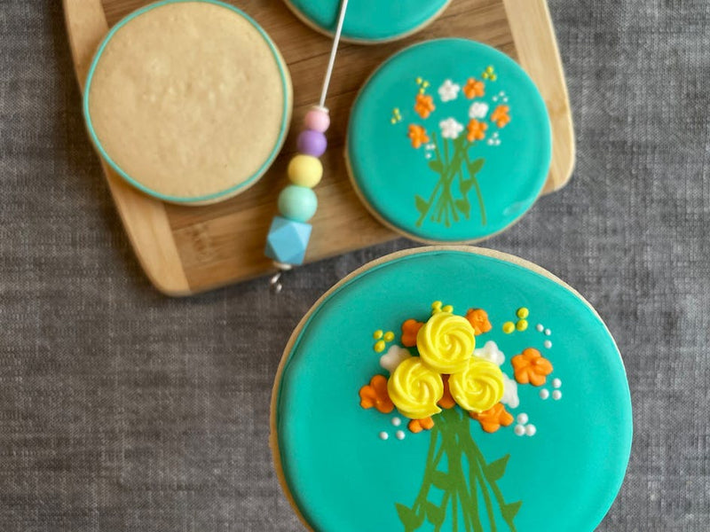 Learn how to ice biscuits using royal icing with these fabulous floral designs