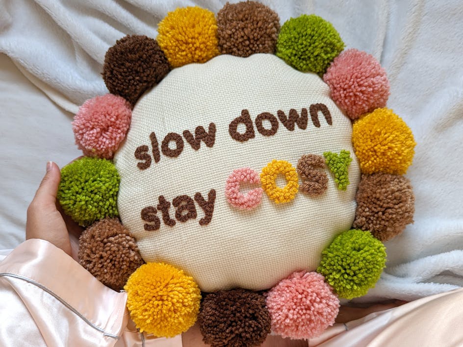 Stay cozy with this pomtastic punch needle cushion tutorial