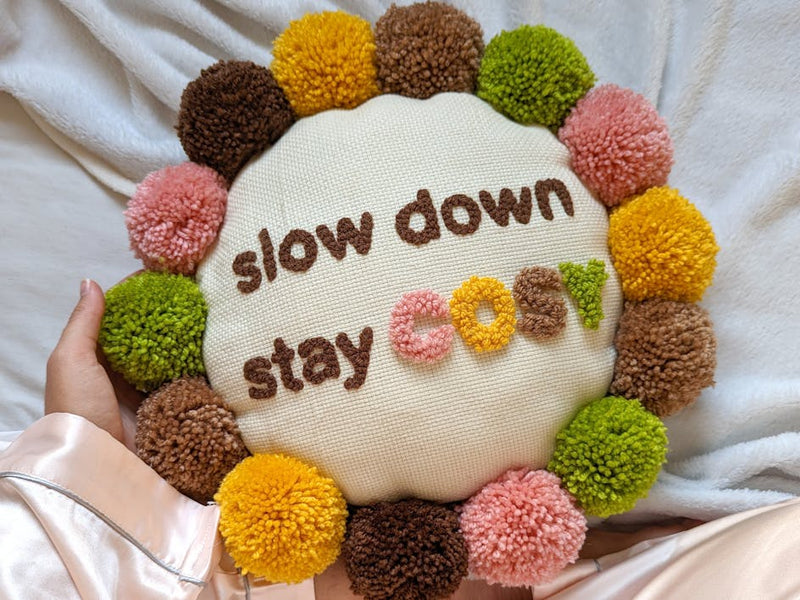 Stay cozy with this pomtastic punch needle cushion tutorial