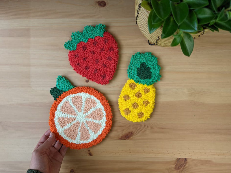 Learn how to make a fruity punch needle coaster trio