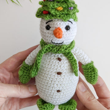 Crochet snowman in a Christmas tree hat amigurumi pattern