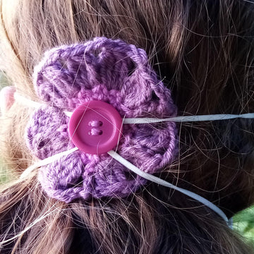 Crochet flower to hold facemask in place