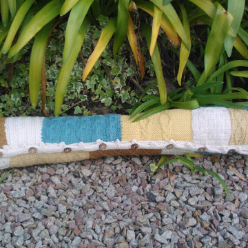 Knitted patchwork cushion, footstool, draught excluder, rug, living room collection