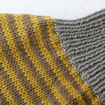 Strickanleitung Pucksack Kuschel, von 0 bis 12 Monate, Anfängerfreundlich