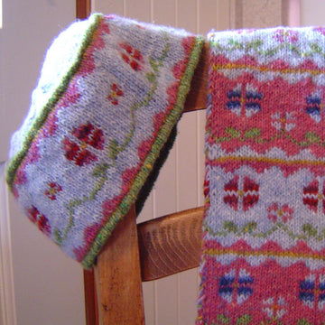 Flowers in winter scarf and hat