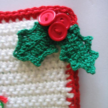Christmas tree potholder with holly leaf clusters