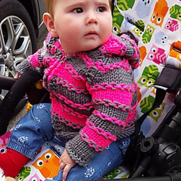 Enveloping baby cardigan