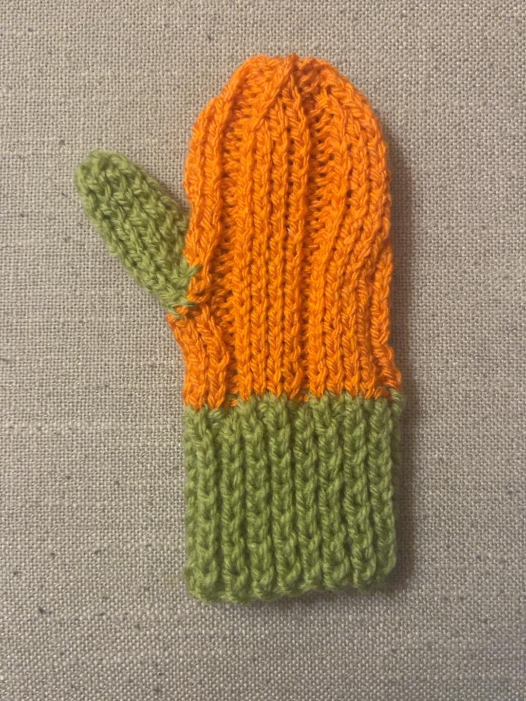 Knitted pumpkin mittens