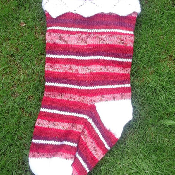 Three traditional knitted Christmas stockings