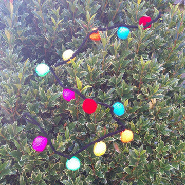 Bright Christmas decorations - lights, baubles, mini stockings