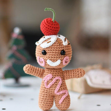 Amigurumi gingerbread with a cherry on top