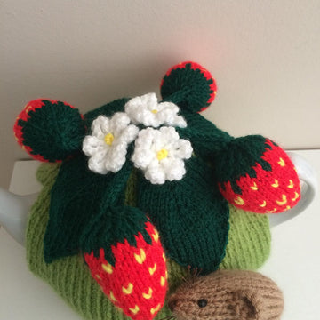 Nature tea cosy. Animal tea cosy .Pesky mouse in the strawberry patch
