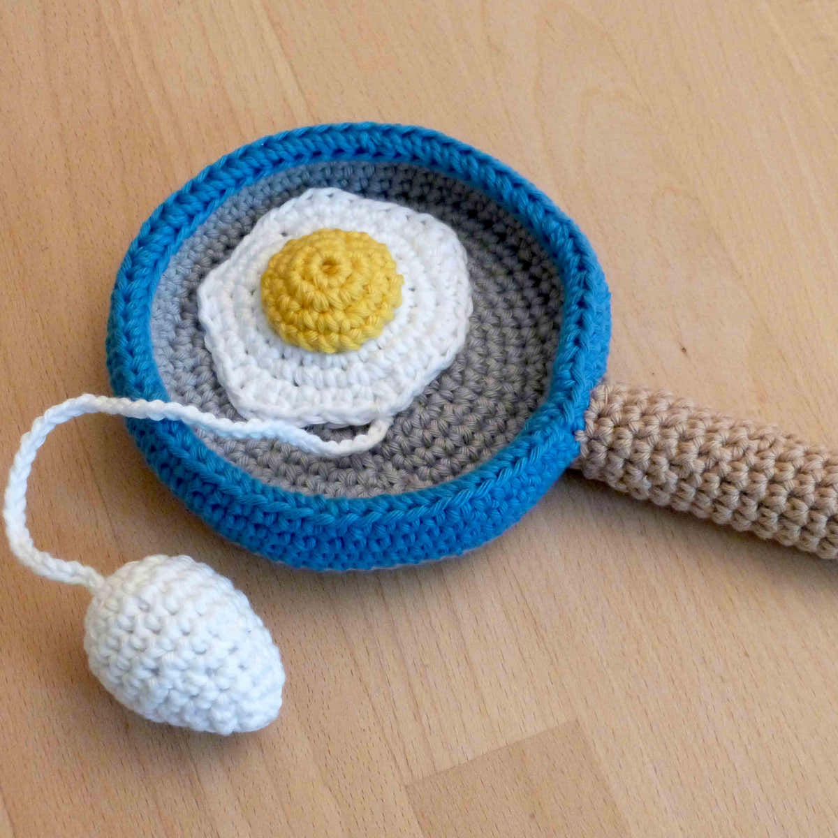 Cup and ball game: pan with eggs