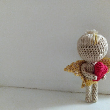 Tiny Cupid with heart