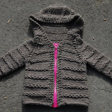 Enveloping baby cardigan