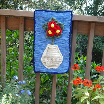 Red Flowers in a White Vase