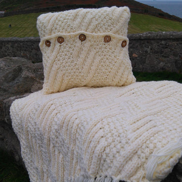 Chunky rug and cushion with diamond moss stitch pattern