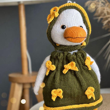 Knitting toy clothes for goose
