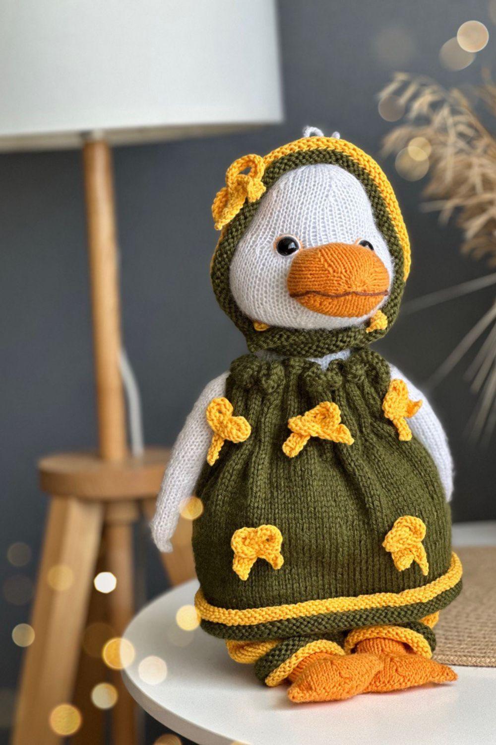 Knitting toy clothes for goose