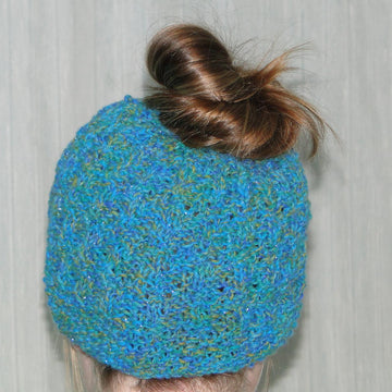 Flo's messy bun hat