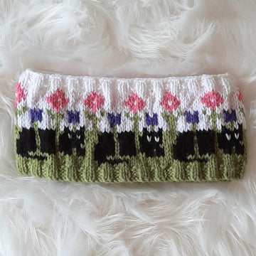 Cats in the flowerbed