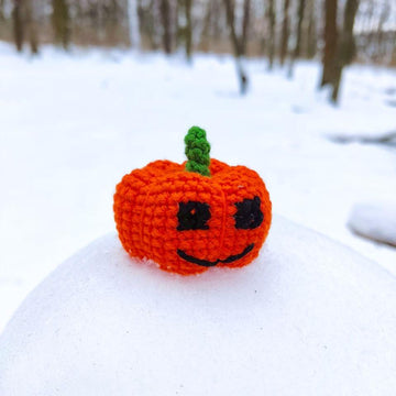 Halloween black gnome with pumpkin