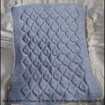 Cabled check blanket to fit car seat, pram or pushchair