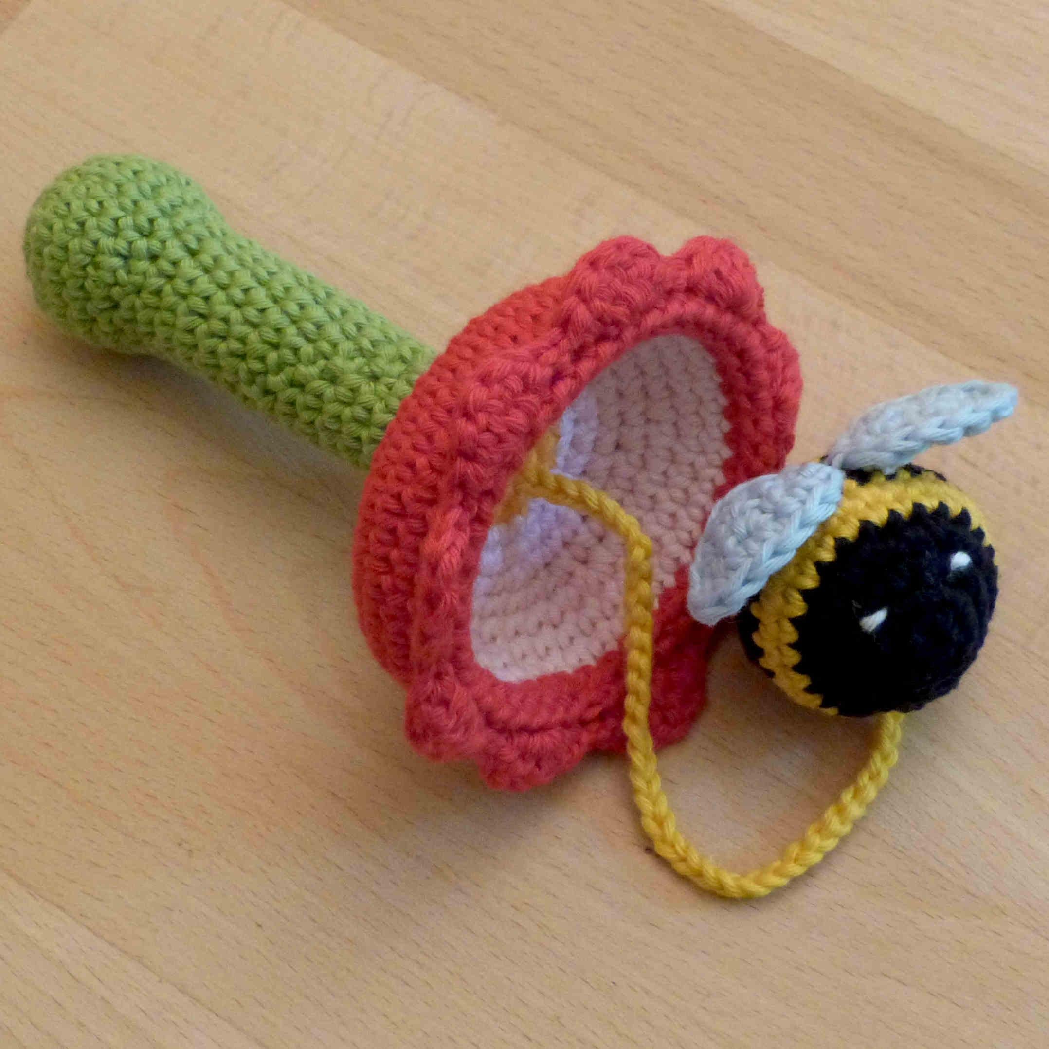 Cup and ball game: flower with bumblebee