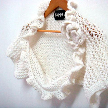 Shrug with short sleeves and floral brooch
