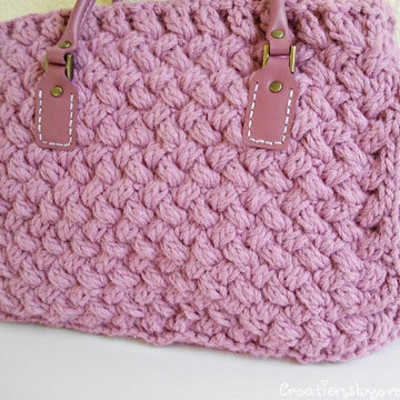Textured bag knitted with woven pattern