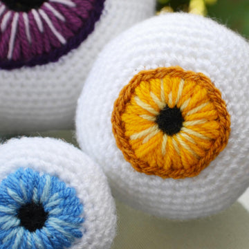 Crochet eyeballs. Creepy eyes. Halloween spooky eyes. Eyeball with blood vessels