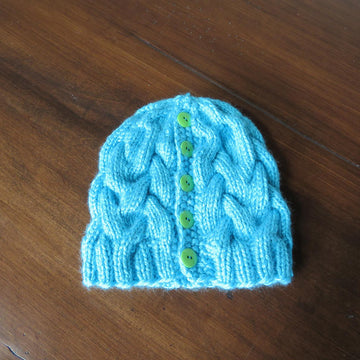 Cozy Cables Ponytail Hat