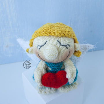 Small Cupid doll knitting flat