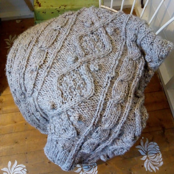 Chunky cable knit throw