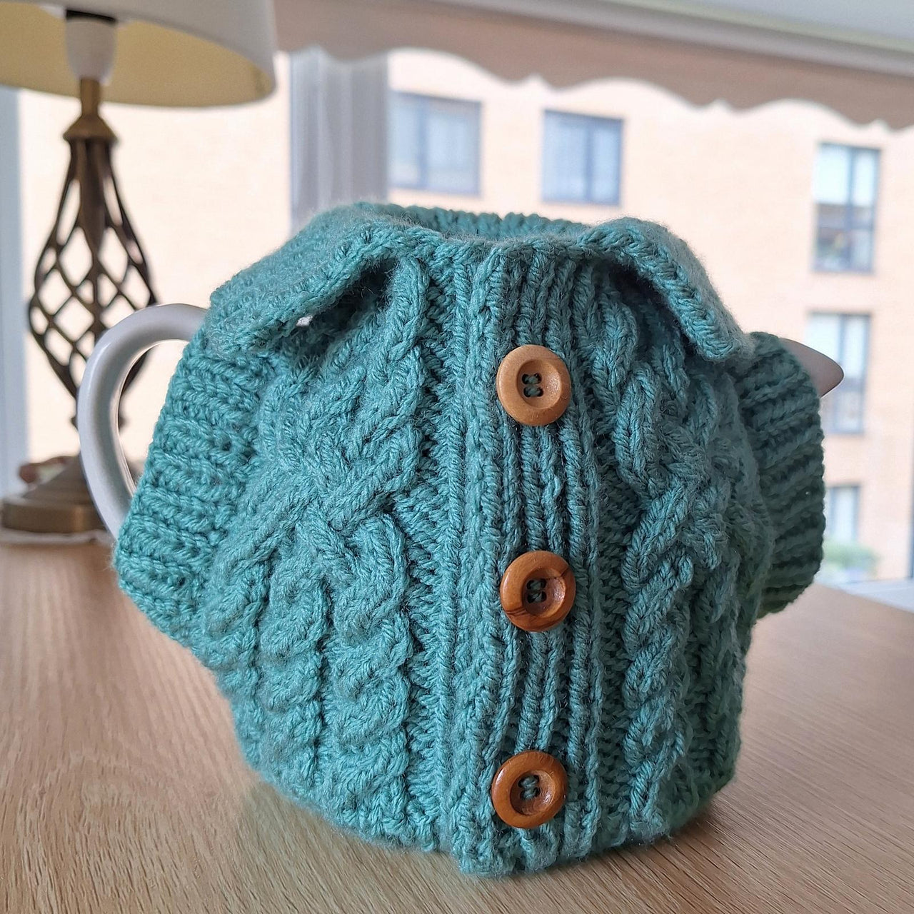 Aran jacket tea cosy
