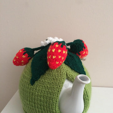 Nature tea cosy. Animal tea cosy .Pesky mouse in the strawberry patch