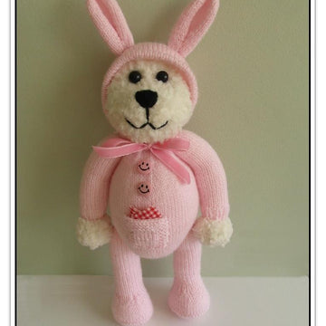 Teddy in a bunny onesie