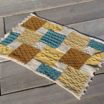 Knitted patchwork cushion, footstool, draught excluder, rug, living room collection
