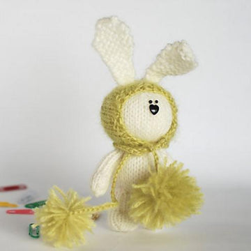 White rabbit in a light green hat