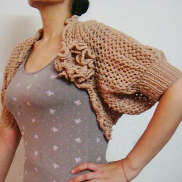 Knit lace shrug with knit flower pin