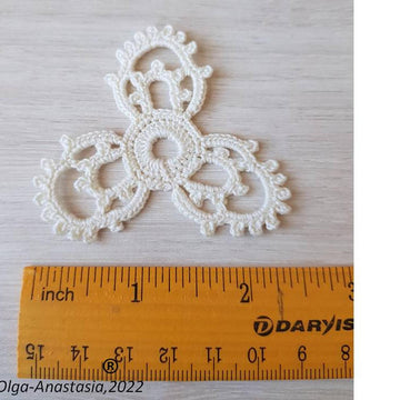Openwork triangular crochet motif