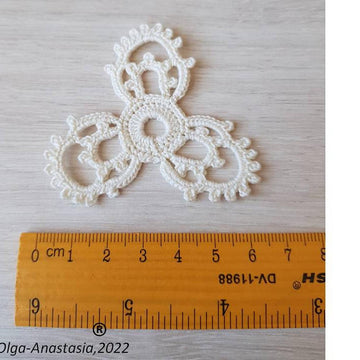 Openwork triangular crochet motif