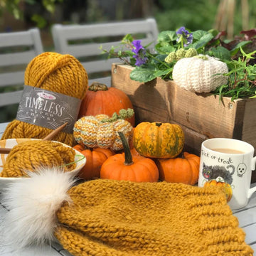 Mustard knitted hat with pom pom