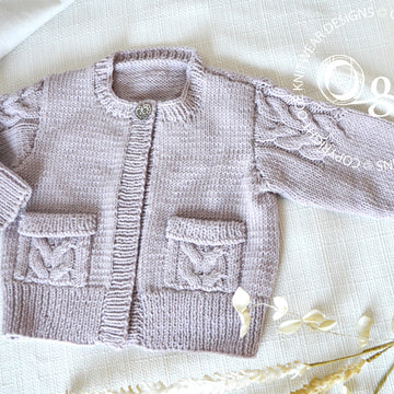 Child’s Cardigan with cable detail on sleeves and pockets - P065
