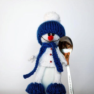 Lovely and sweet Snowman in the blue hat and scarf for keeping warm breakfast egg