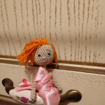 Tiny amigurumi doll