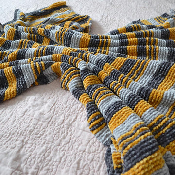 Anteros Throw Blanket