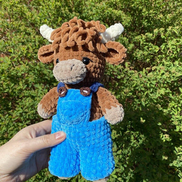 Highland cow with overalls