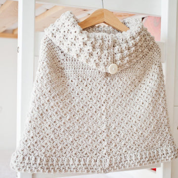 Poncho with oversized collar