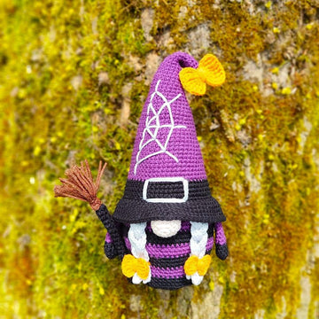 Halloween gnome (girl) with a broom